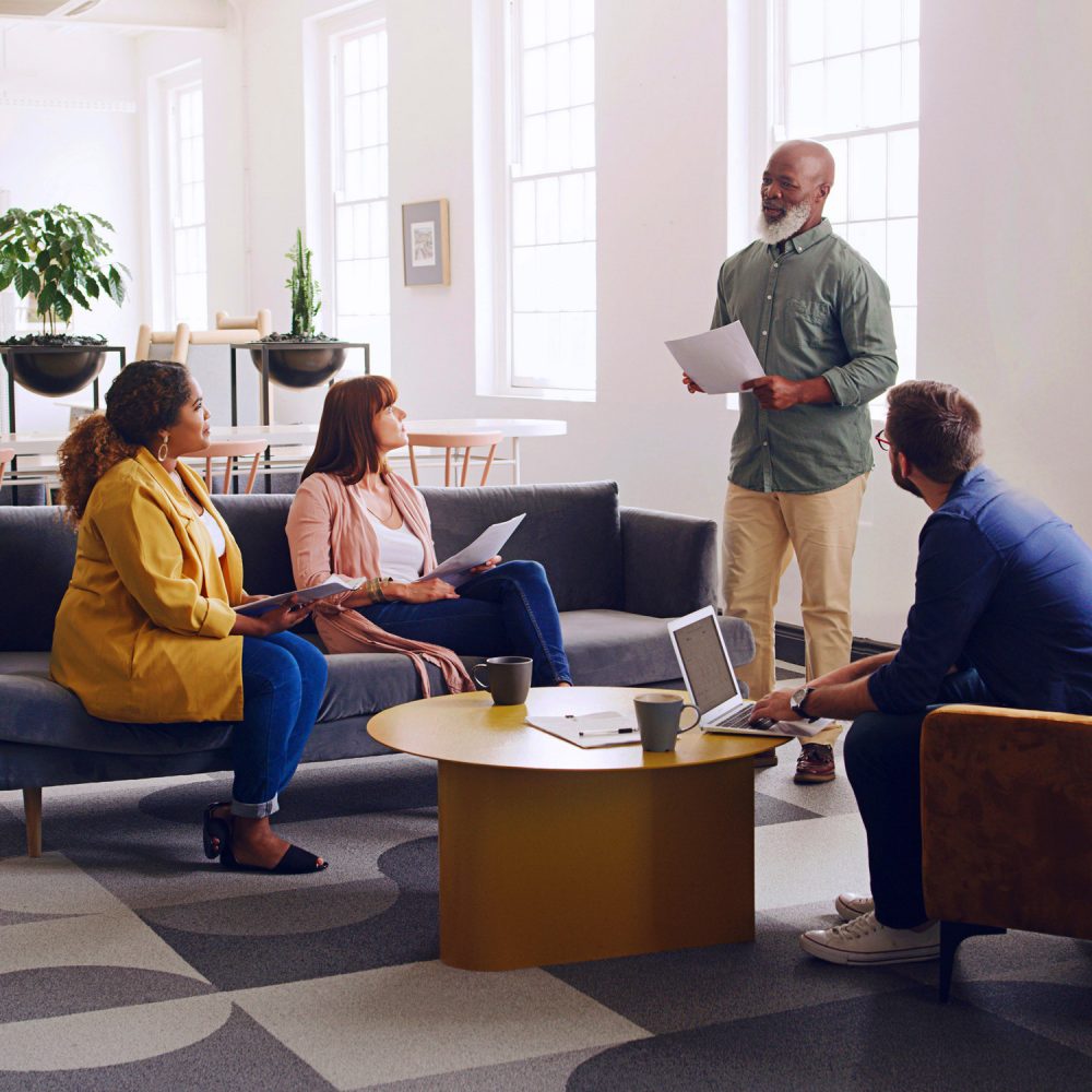 Qynox team collaborating in a meeting room